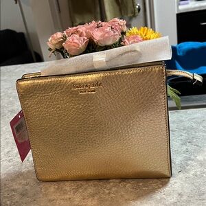 NWT kate spade Metallic Rose Gold Pebbled you can use it for credit
